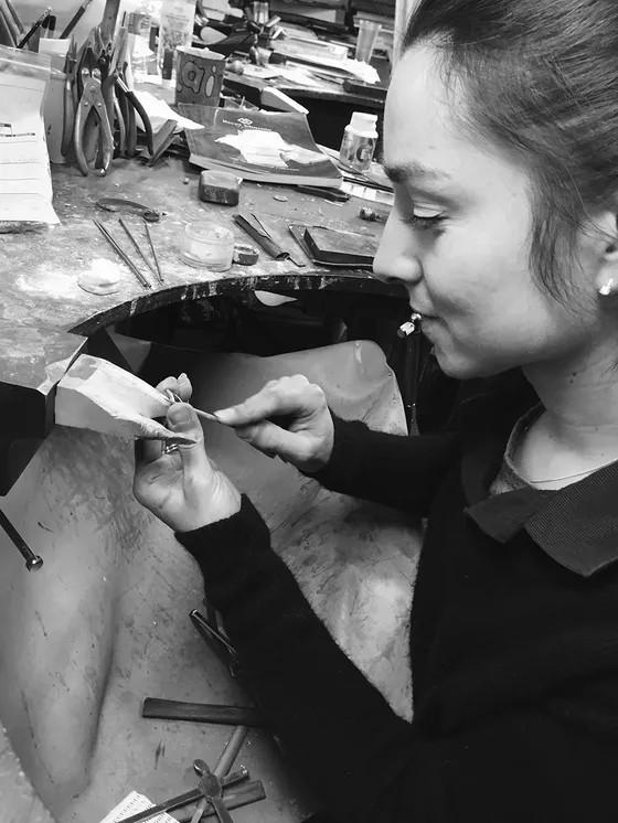 Jeweller at the bench carrying out jewellery work
