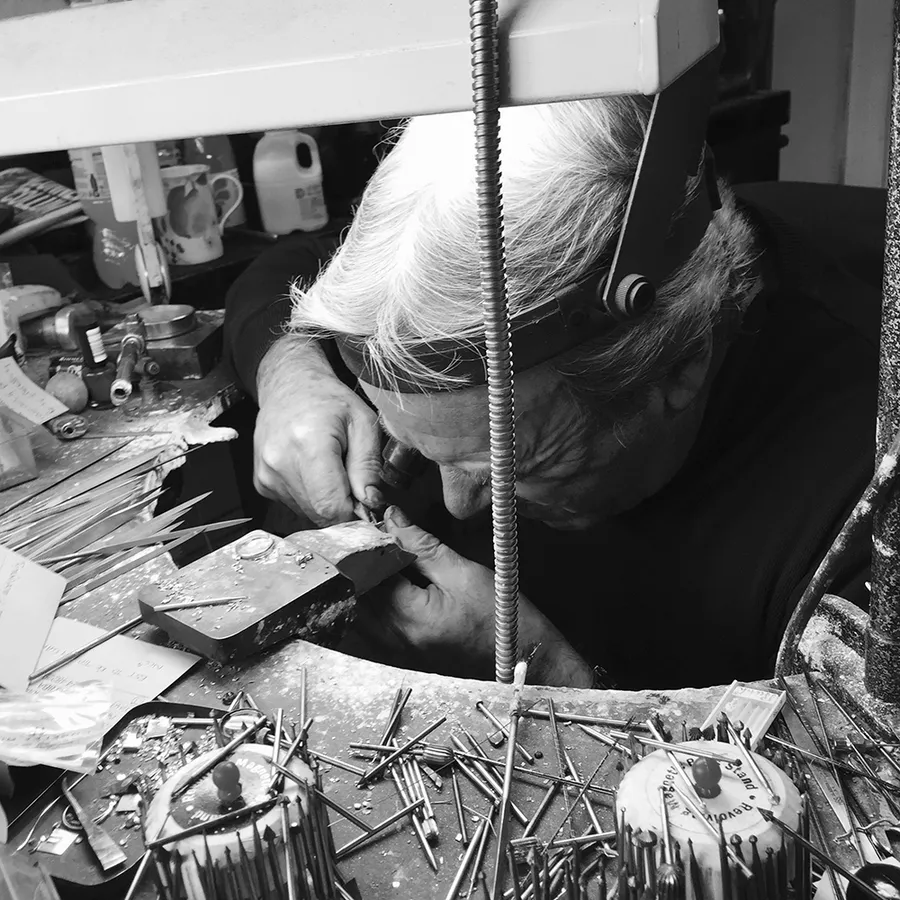 Jeweller working under magnification in the Ian Gallacher workshop, Stirling